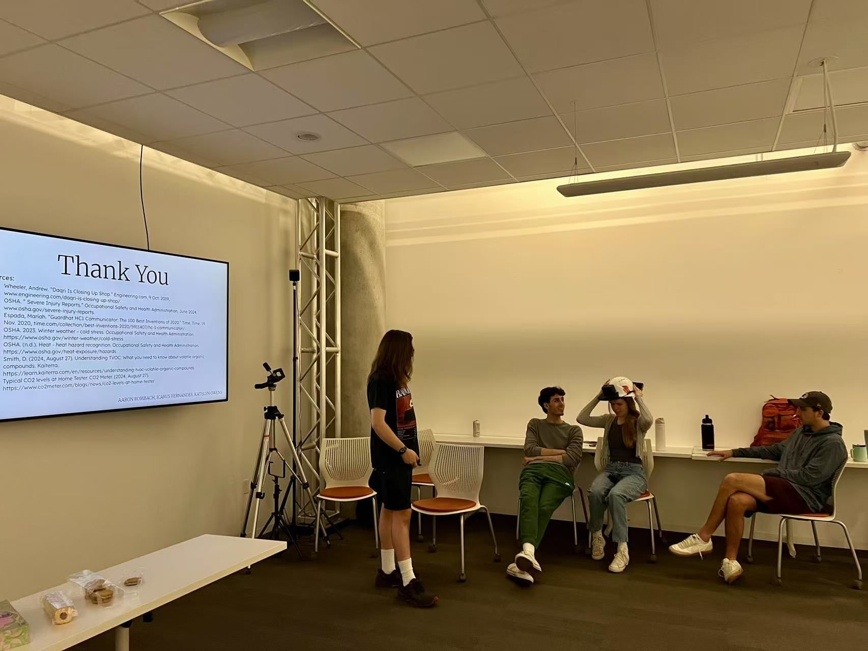 Students sharing construction project findings during final presentations